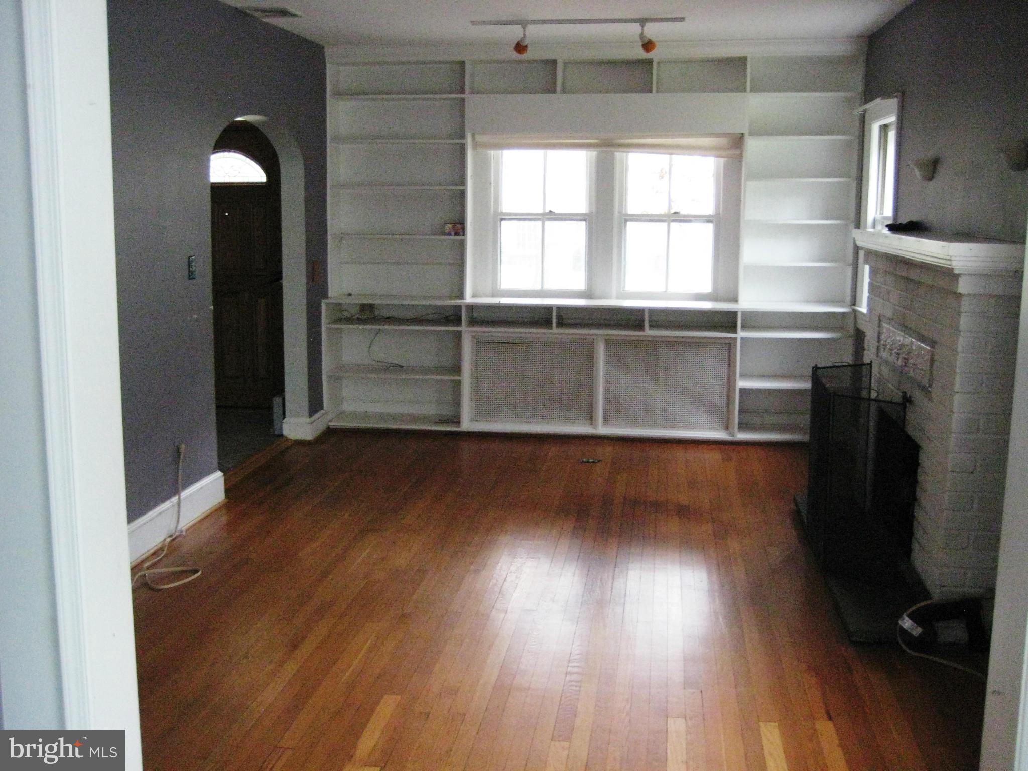 622 Ritchie Avenue Silver Spring, MD 20910 - Photo 3 of 25 a view of empty room with wooden floor and fan