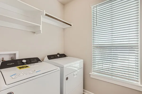 a utility room with dryer and washer