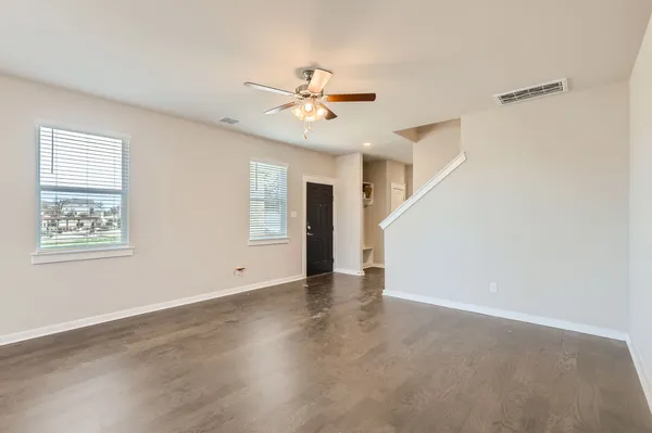 a view of an empty room with a window
