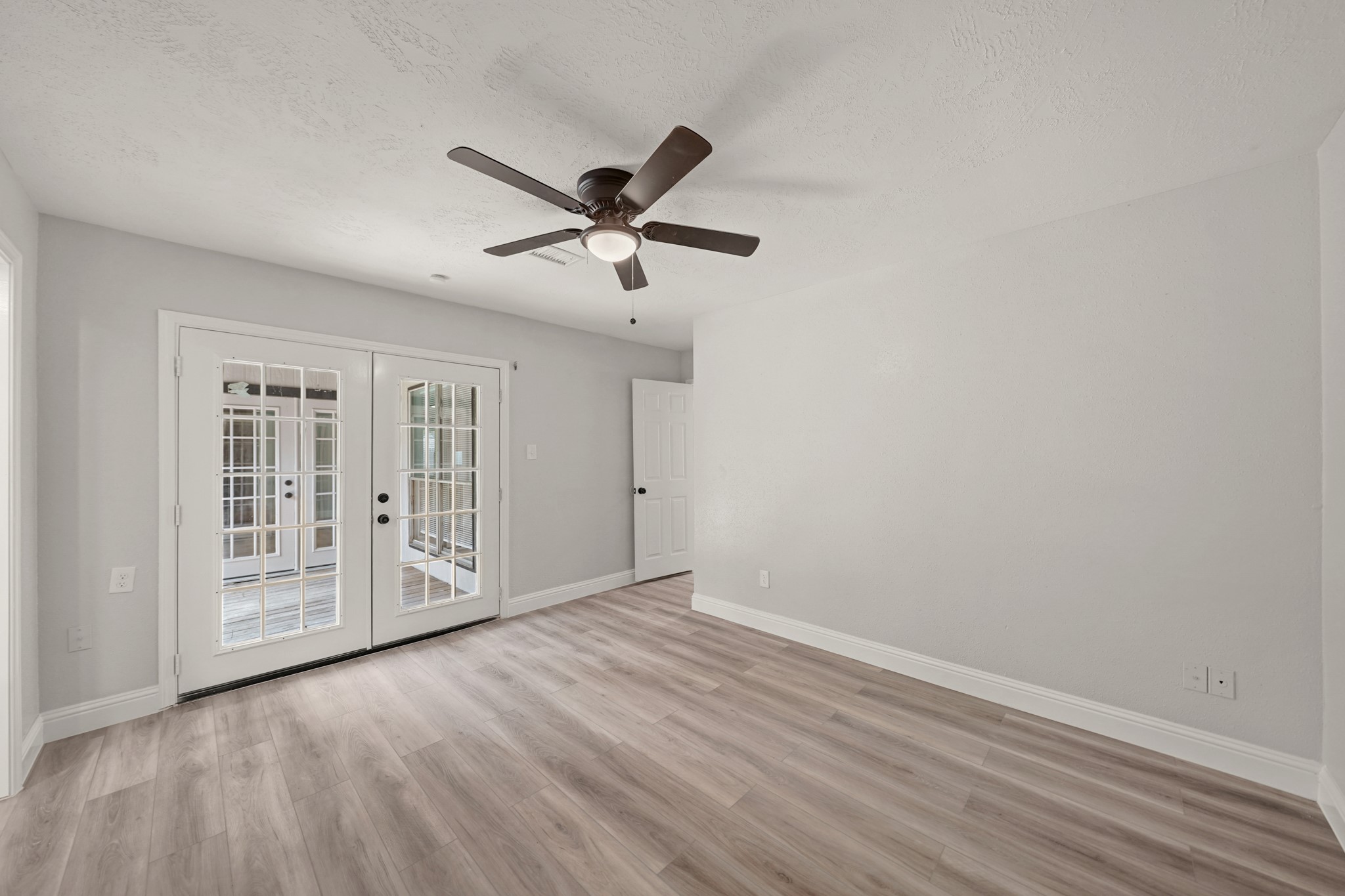 3623 Peachstone Place Spring, TX 77389 - Photo 16 of 20 wooden floor in an empty room with a window