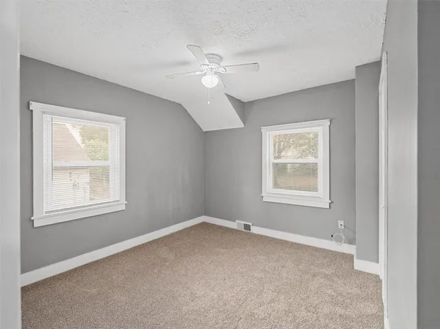 a bathroom with a tub and shower