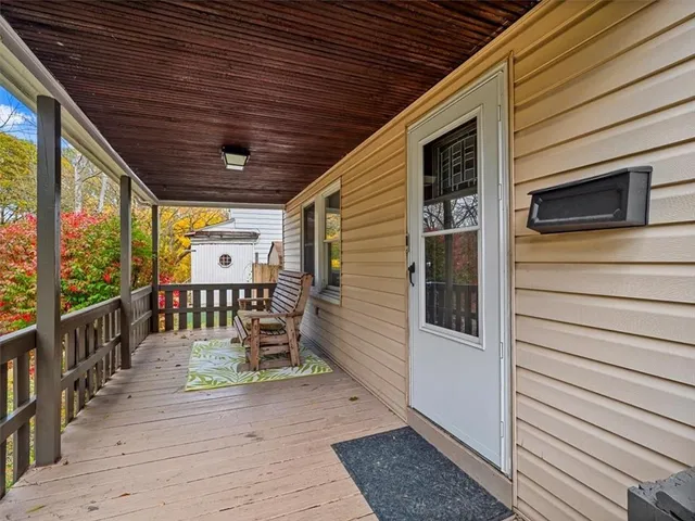 a balcony with wooden floor