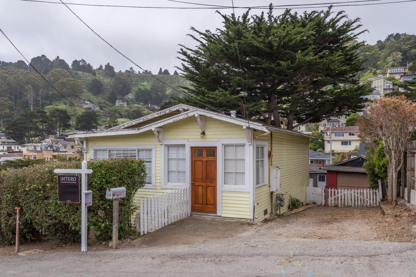 276 Kent Road Pacifica, CA 94044 - Photo 1 of 15 a view of a barn in the middle of a yard
