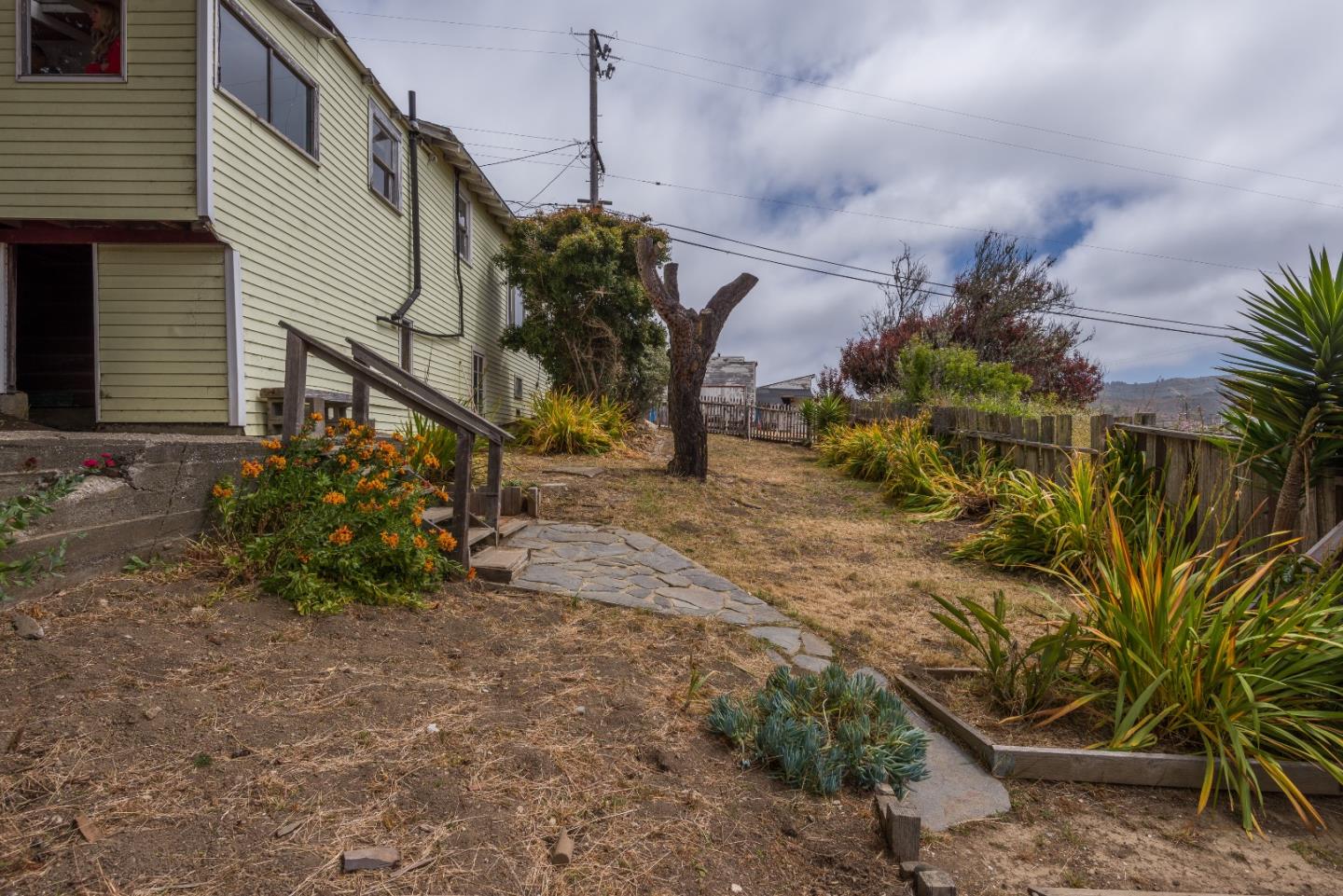 276 Kent Road Pacifica, CA 94044 - Photo 12 of 15 a view of a house with a yard