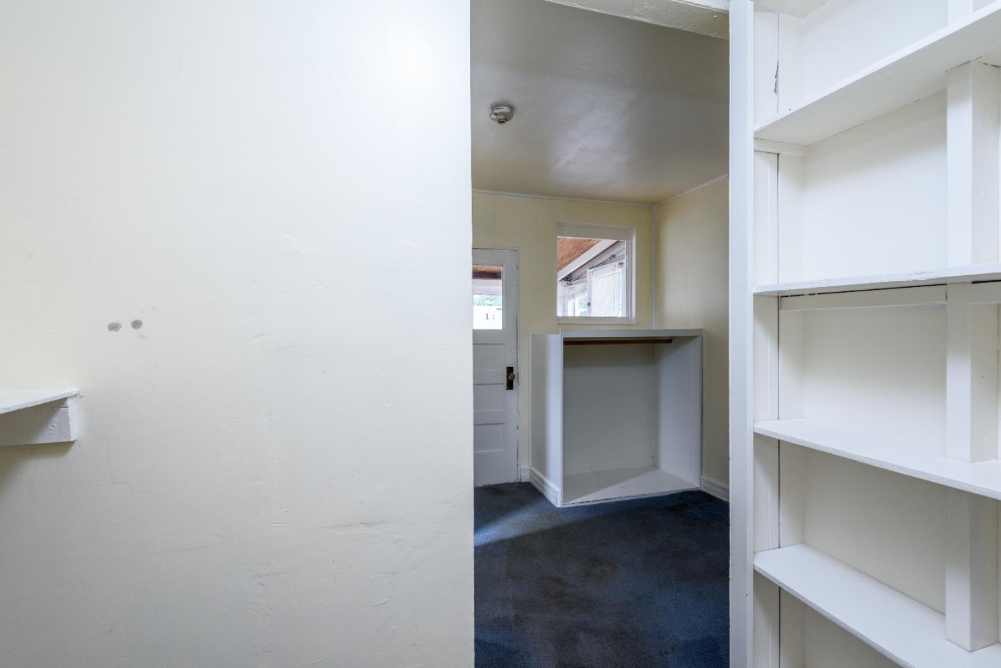 276 Kent Road Pacifica, CA 94044 - Photo 6 of 15 a view of a hallway with wooden floor