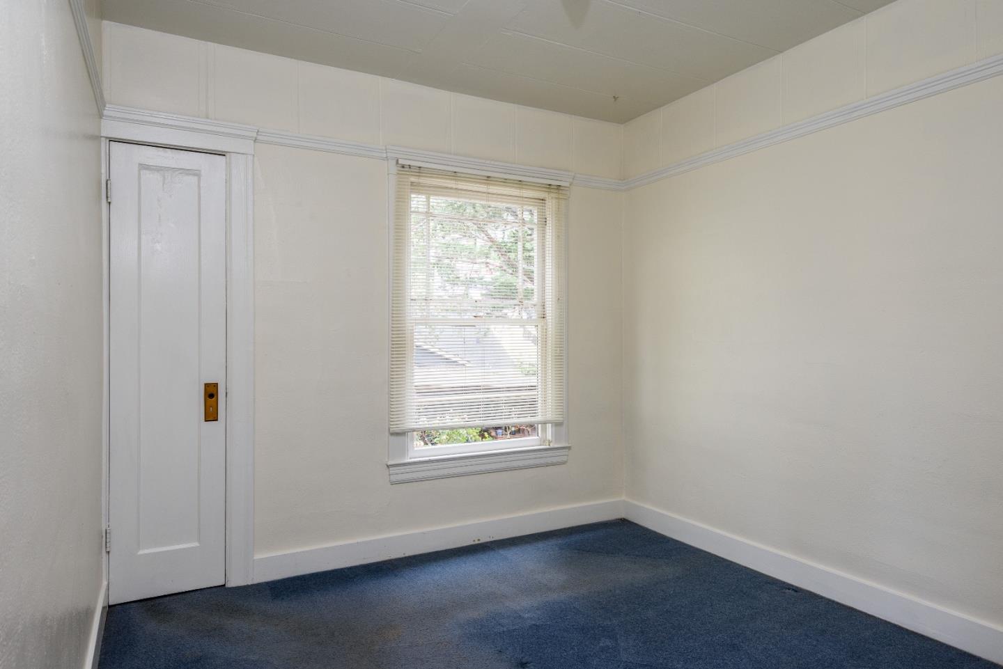276 Kent Road Pacifica, CA 94044 - Photo 7 of 15 an empty room with a window
