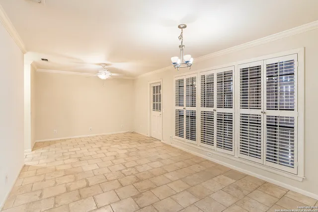 a view of empty room with windows