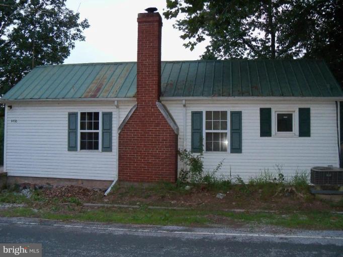 4496 Baptist Road Taneytown, MD 21787 - Photo 3 of 13 a front view of a house with garden