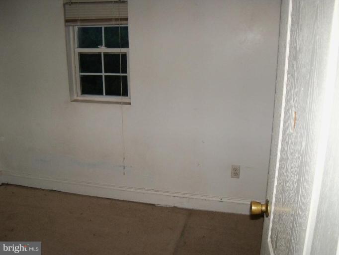 4496 Baptist Road Taneytown, MD 21787 - Photo 5 of 13 wooden floor in an empty room