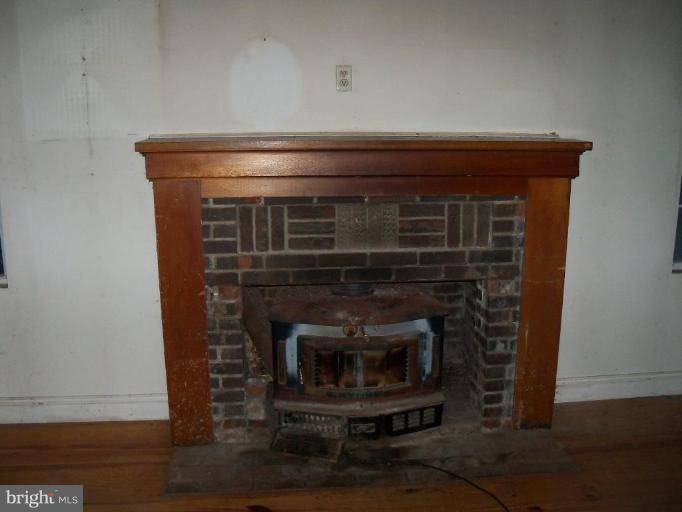 4496 Baptist Road Taneytown, MD 21787 - Photo 9 of 13 a stove top oven sitting inside of a kitchen