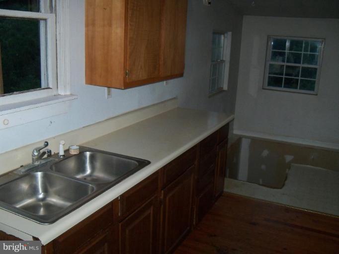 4496 Baptist Road Taneytown, MD 21787 - Photo 10 of 13 a kitchen that has a sink and a stove