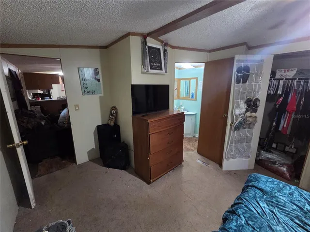 a view of a livingroom with furniture and a flat screen tv