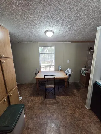 a living room with furniture a window and a table