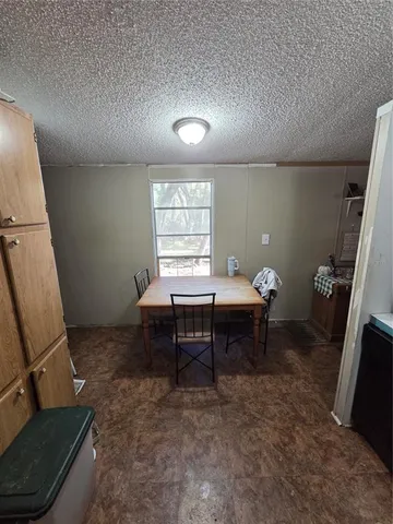a living room with furniture a window and a table