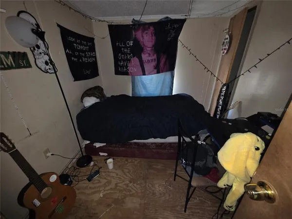 a living room with furniture and a mirror