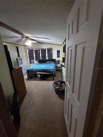 a view of a livingroom with furniture and a window