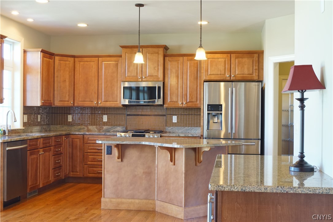 6244 Steinway Drive DeWitt, NY 13078 - Photo 13 of 36 Bright and cheery kitchen with maple cabinets, wel