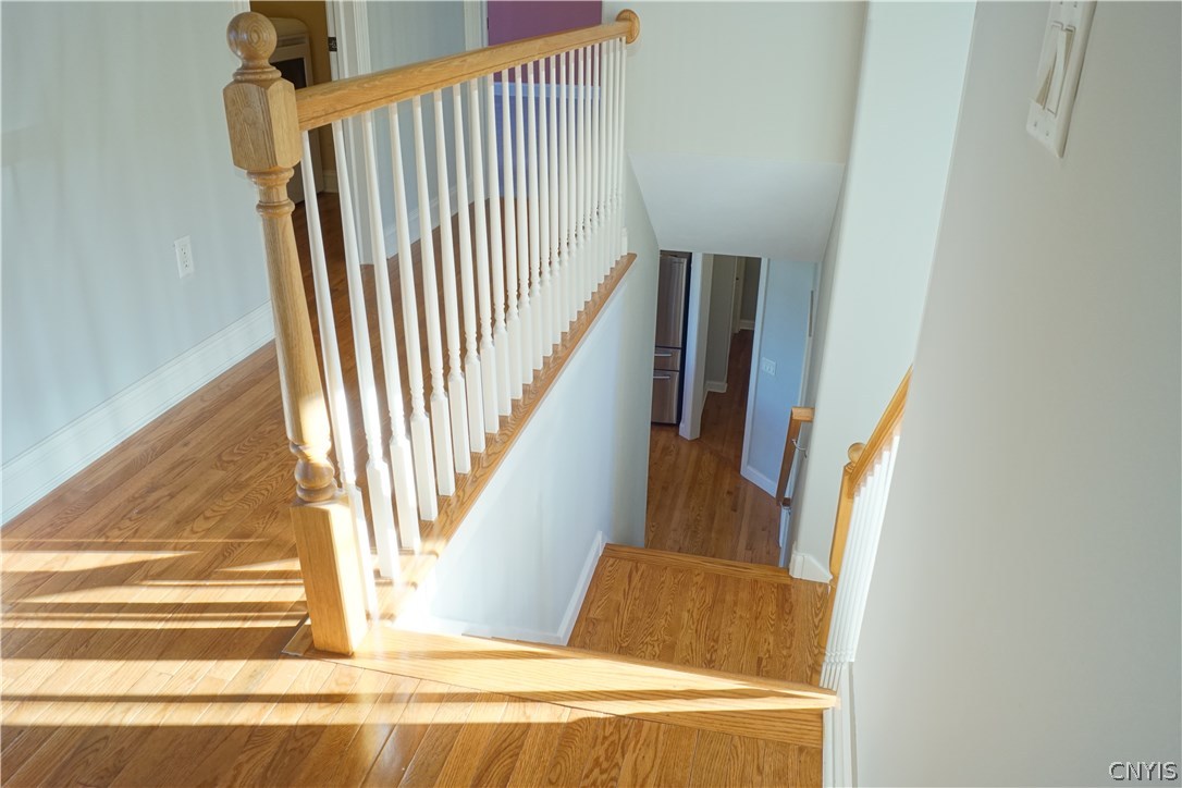 6244 Steinway Drive DeWitt, NY 13078 - Photo 19 of 36 "Secret" staircase conveniently connects the kitch