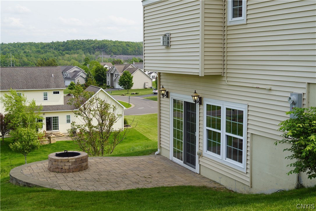 6244 Steinway Drive DeWitt, NY 13078 - Photo 7 of 36 Fire pit patio for lots of summer fun. Kitchen in