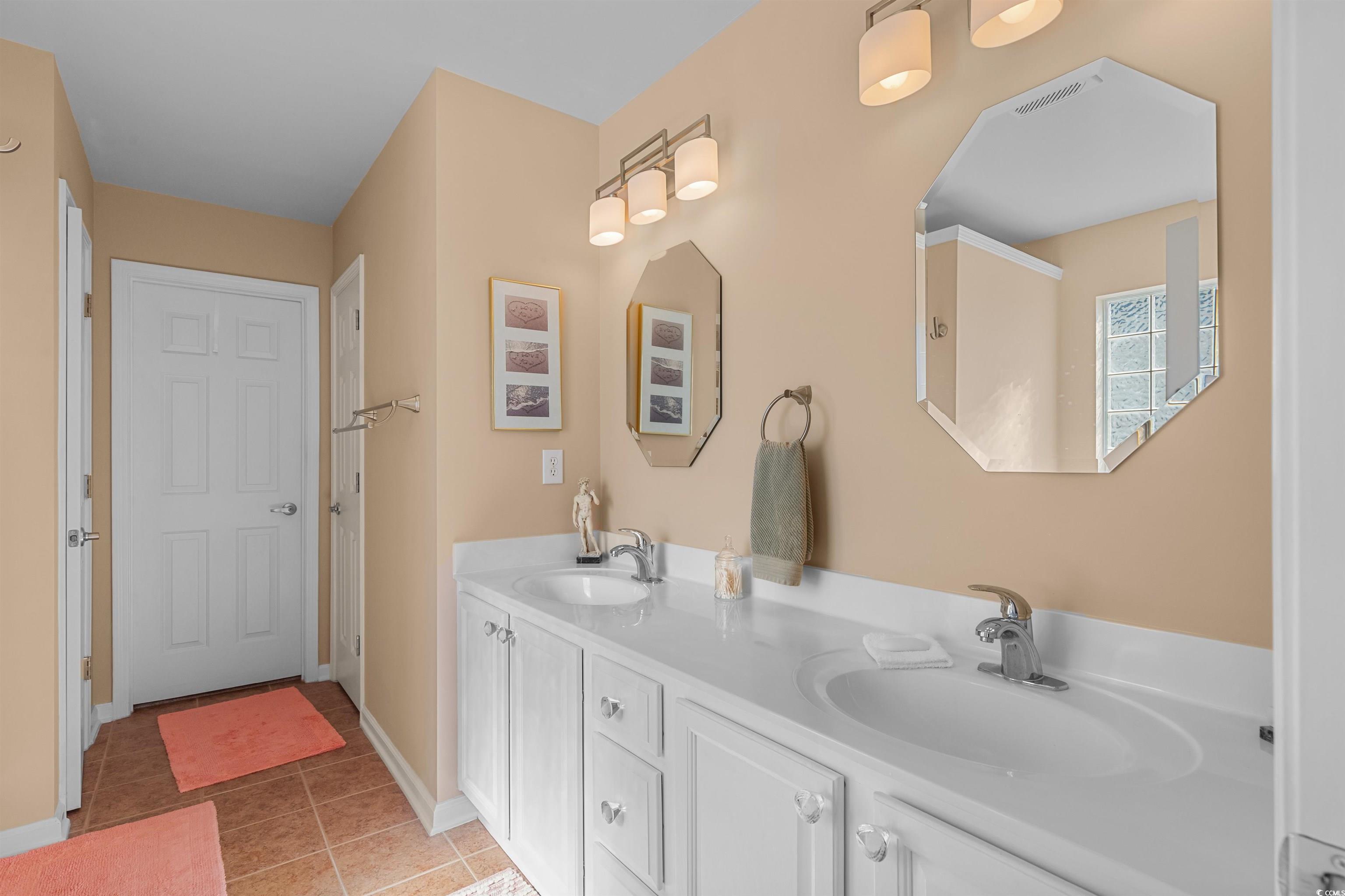 3505 Arrowhead Boulevard Myrtle Beach, SC 29579 - Photo 15 of 40 Full bathroom with double vanity and light tile patterned floors
