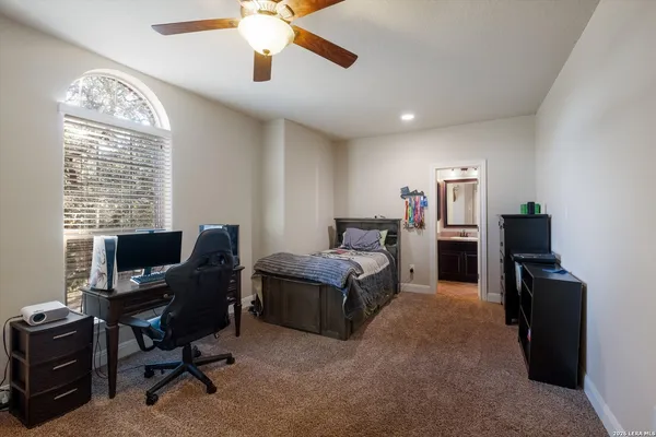 a view of a livingroom with workspace and a window