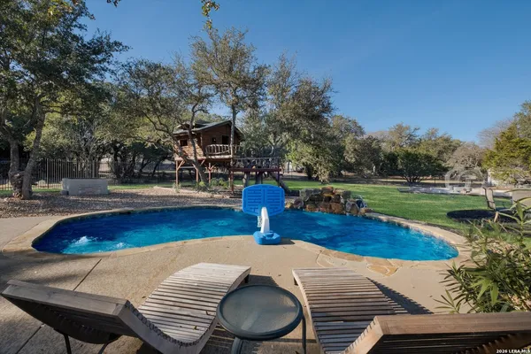 a wooden bench sitting on top of a wooden floor