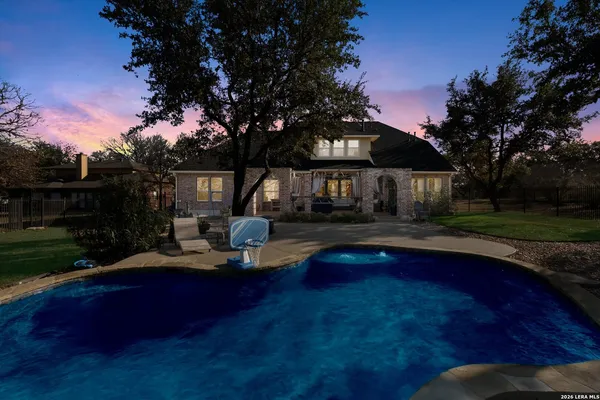 a living room with patio furniture and garden