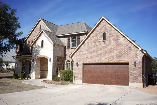 a front view of a house with a garage