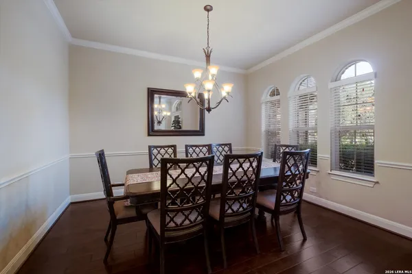 a view of a dining room with furniture and wooden floor