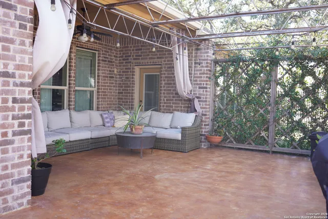 a view of a wooden house with large trees