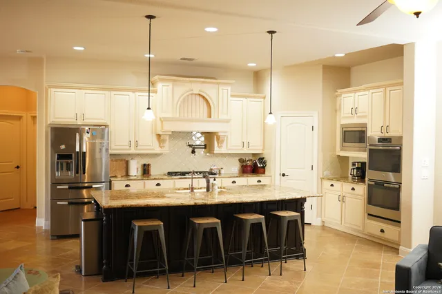 a kitchen with sink cabinets and outdoor living room