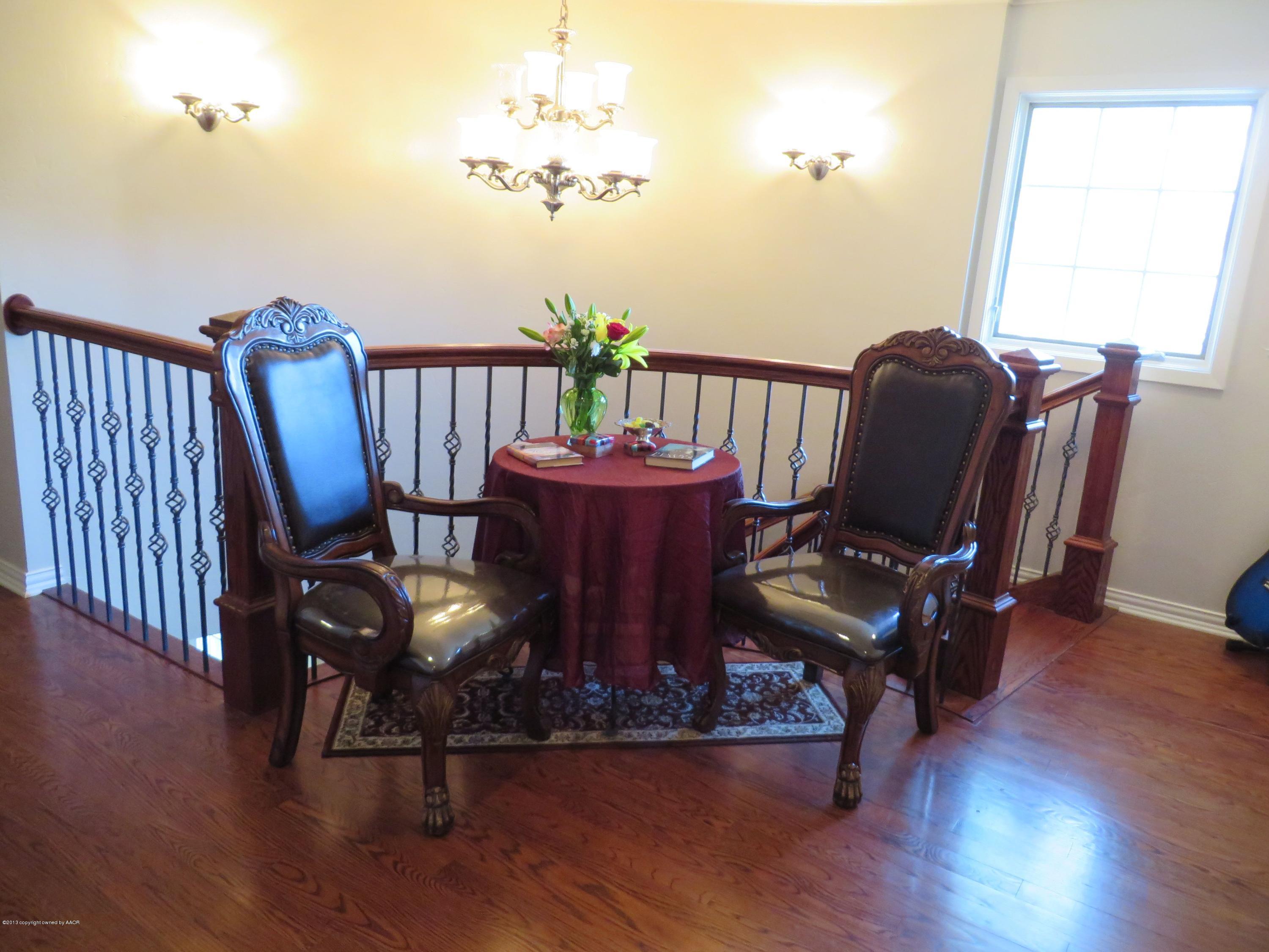 6713 Jameson Road Amarillo, TX 79106 - Photo 12 of 23 a view of a dining room with furniture window and wooden floor