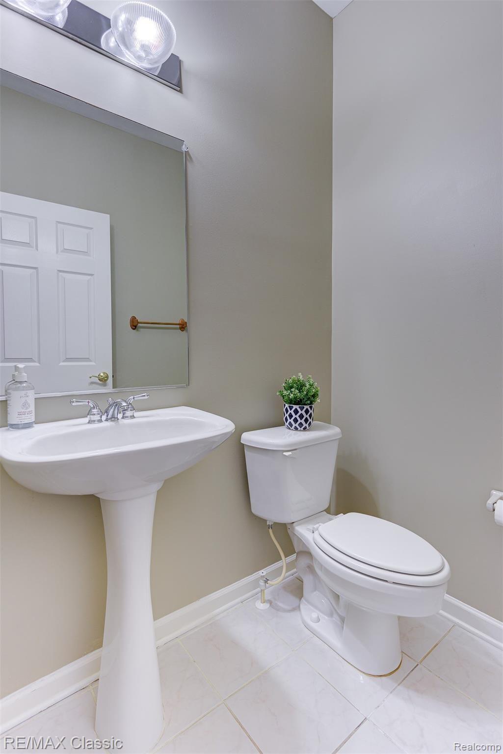 41620 Mitchell Road Novi, MI 48377 - Photo 8 of 40 Convenient lavatory off the garage / patio entrance