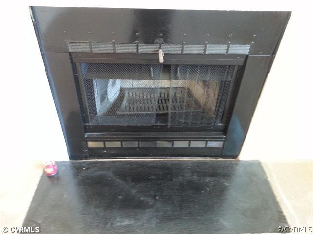 6591 Balsam Road Richmond, VA 23225 - Photo 12 of 24 a view of fireplace and wooden floor