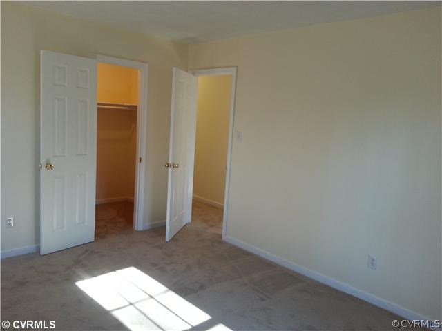 6591 Balsam Road Richmond, VA 23225 - Photo 13 of 24 an empty room with an entrance to other room