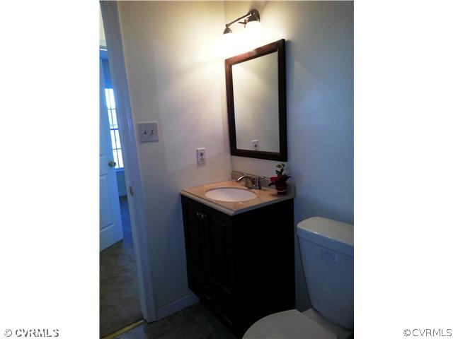6591 Balsam Road Richmond, VA 23225 - Photo 15 of 24 a bathroom with a sink and a mirror