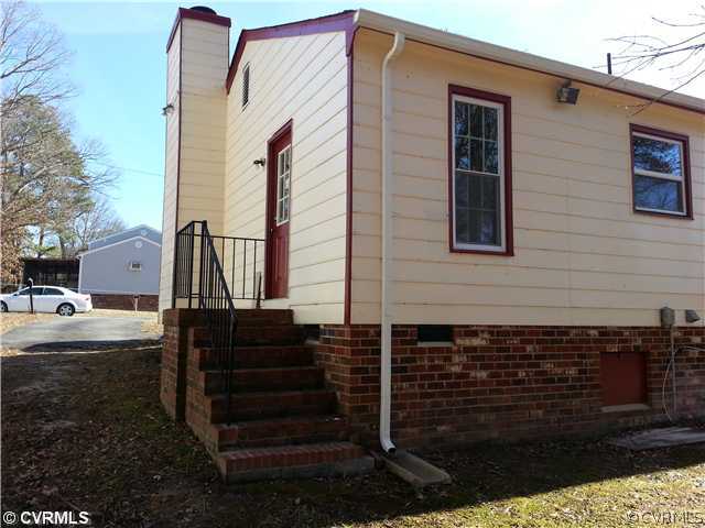 6591 Balsam Road Richmond, VA 23225 - Photo 20 of 24 a front view of a house with a yard