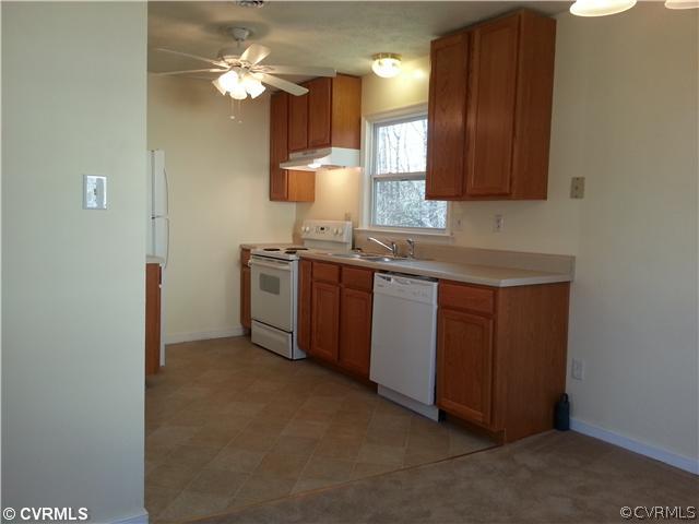 6591 Balsam Road Richmond, VA 23225 - Photo 22 of 24 a kitchen with a sink cabinets and window
