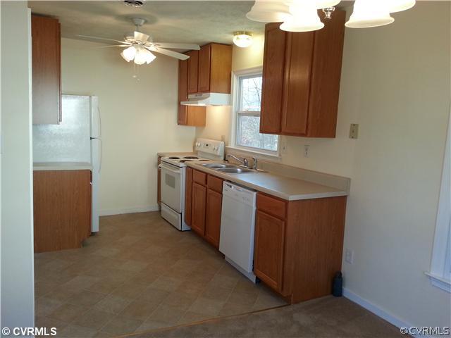 6591 Balsam Road Richmond, VA 23225 - Photo 7 of 24 a kitchen with cabinets a sink and appliances