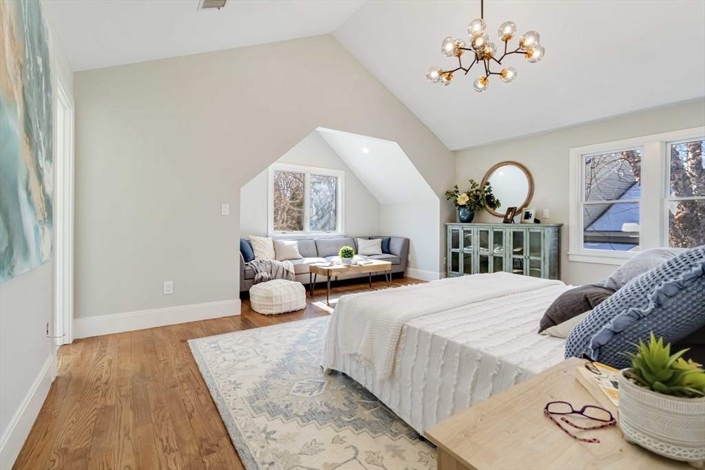 3 Cedar Street Newton, MA 02459 - Photo 14 of 33 a bedroom with a bed mirror and a large window