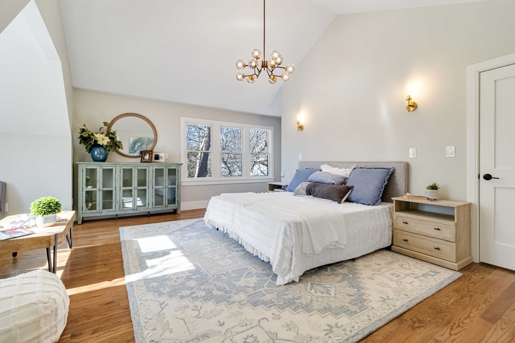3 Cedar Street Newton, MA 02459 - Photo 15 of 33 a spacious bedroom with a bed a dresser and window