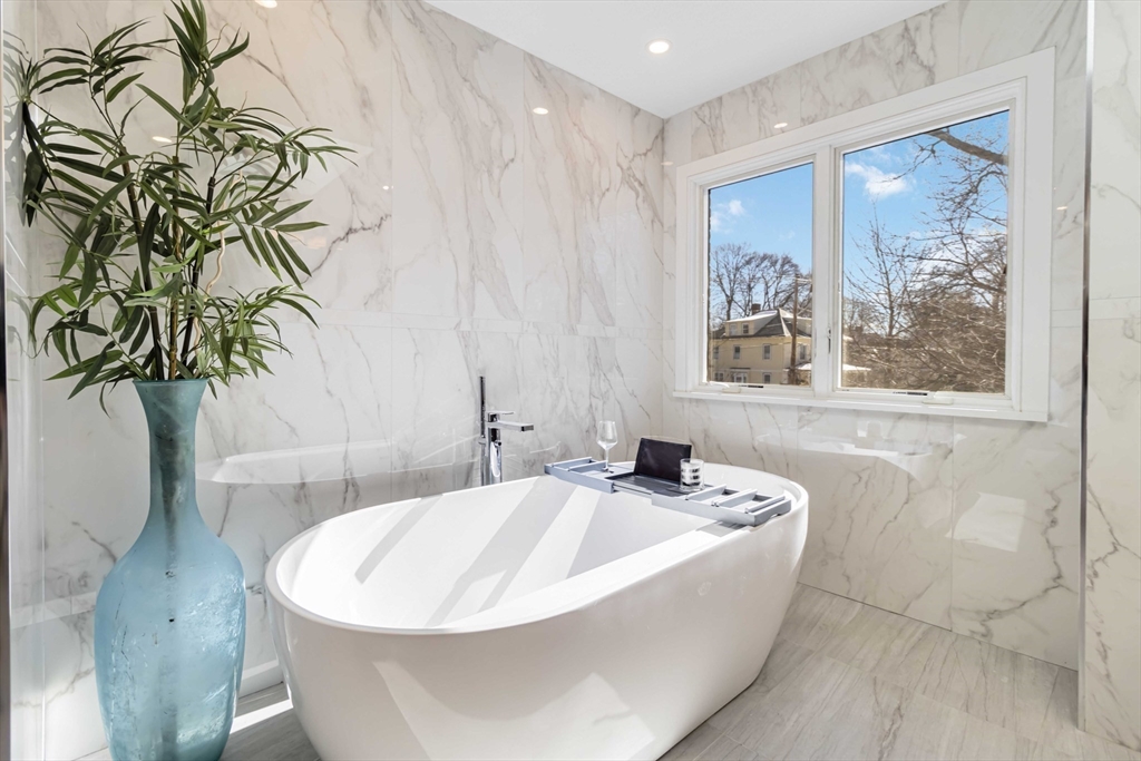 3 Cedar Street Newton, MA 02459 - Photo 20 of 33 a bathroom with a bathtub and shower