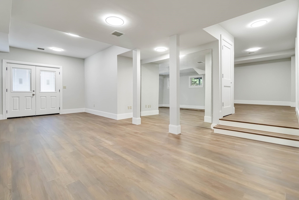 3 Cedar Street Newton, MA 02459 - Photo 26 of 33 an empty room with wooden floor and windows