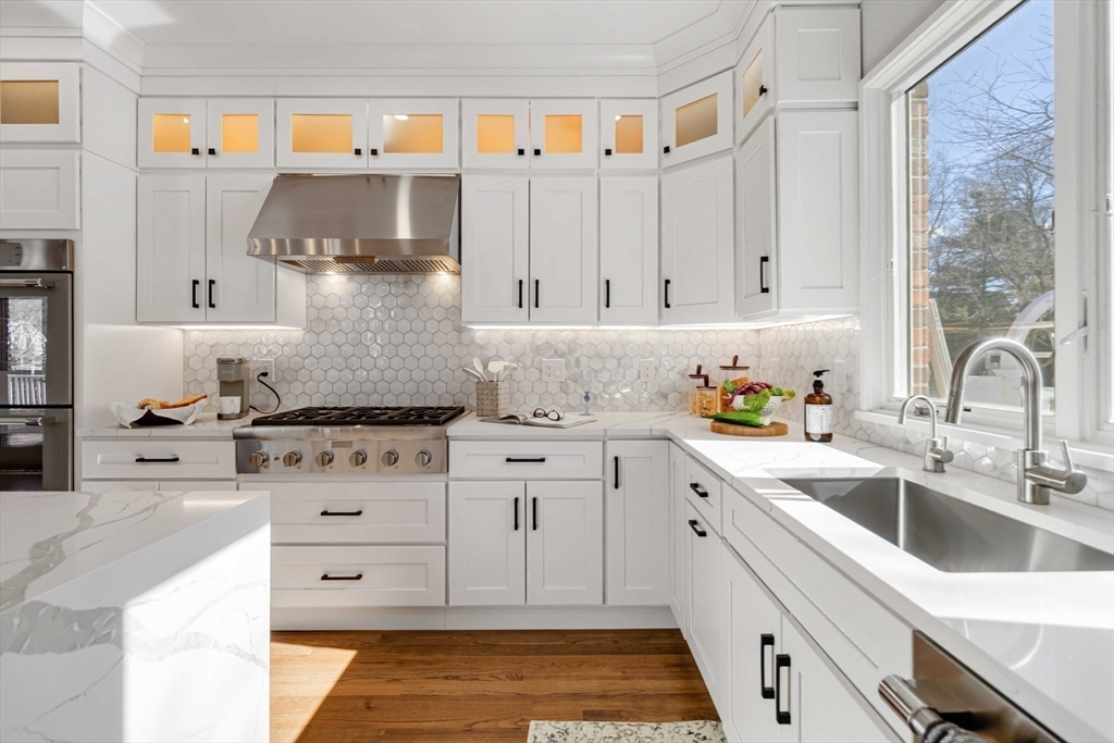 3 Cedar Street Newton, MA 02459 - Photo 9 of 33 a kitchen with granite countertop a sink stainless steel appliances and cabinets
