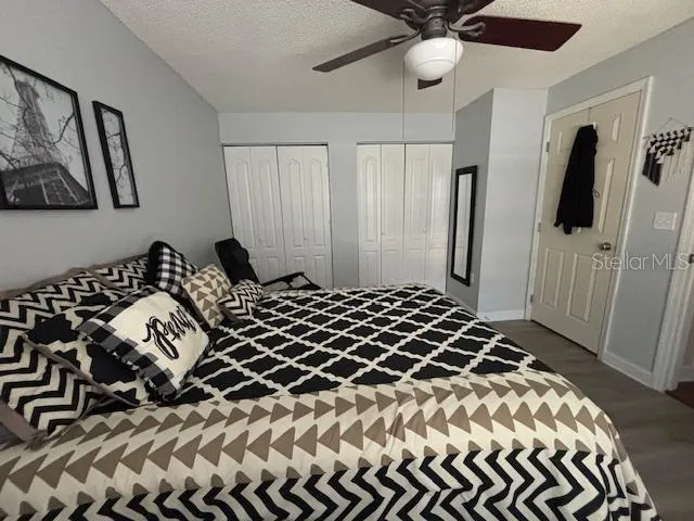 a bedroom with a bed and a walk in closet