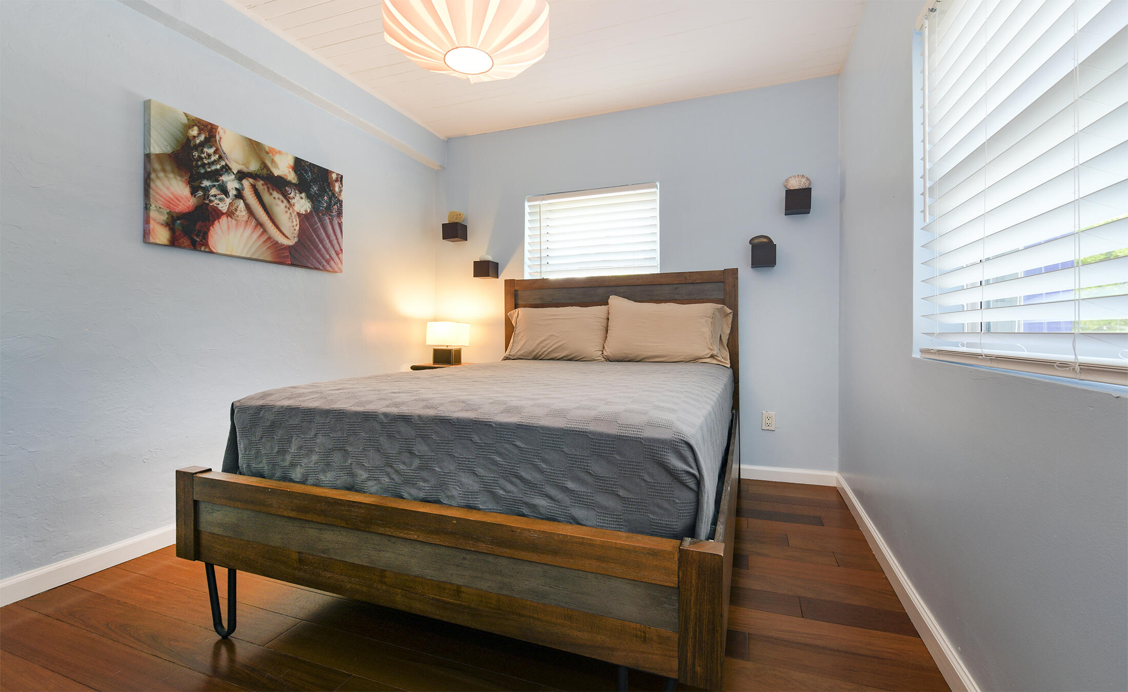 109 Beach Road Islamorada, FL 33036 - Photo 12 of 30 a bedroom with a bed and wooden floor