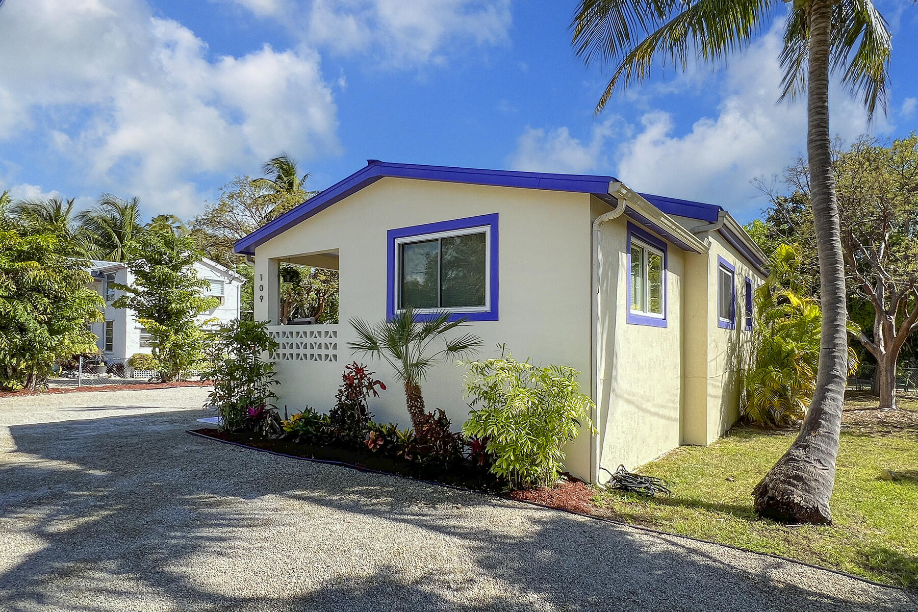 109 Beach Road Islamorada, FL 33036 - Photo 2 of 30 a front view of a house with garden