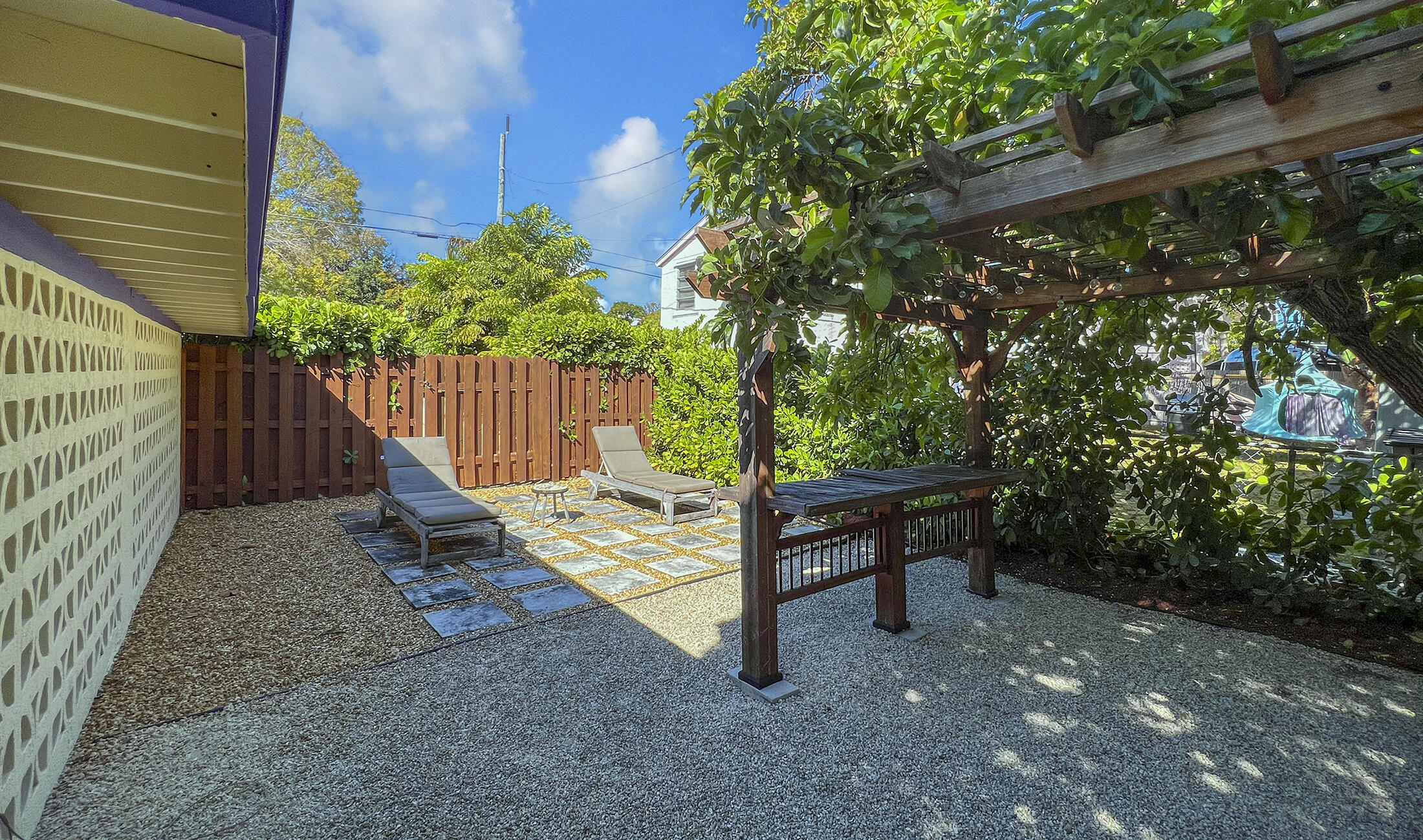 109 Beach Road Islamorada, FL 33036 - Photo 23 of 30 a view of a bench in a backyard