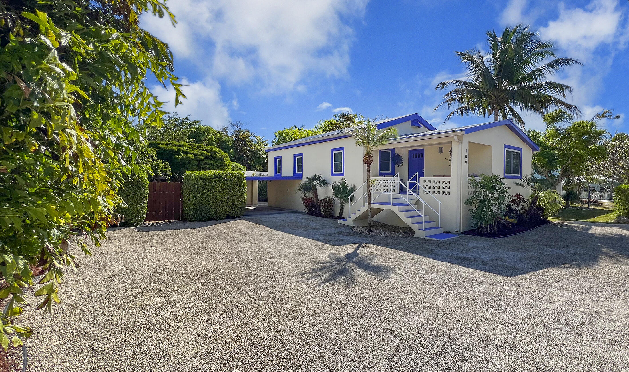 109 Beach Road Islamorada, FL 33036 - Photo 3 of 30 a view of a house with backyard and garden