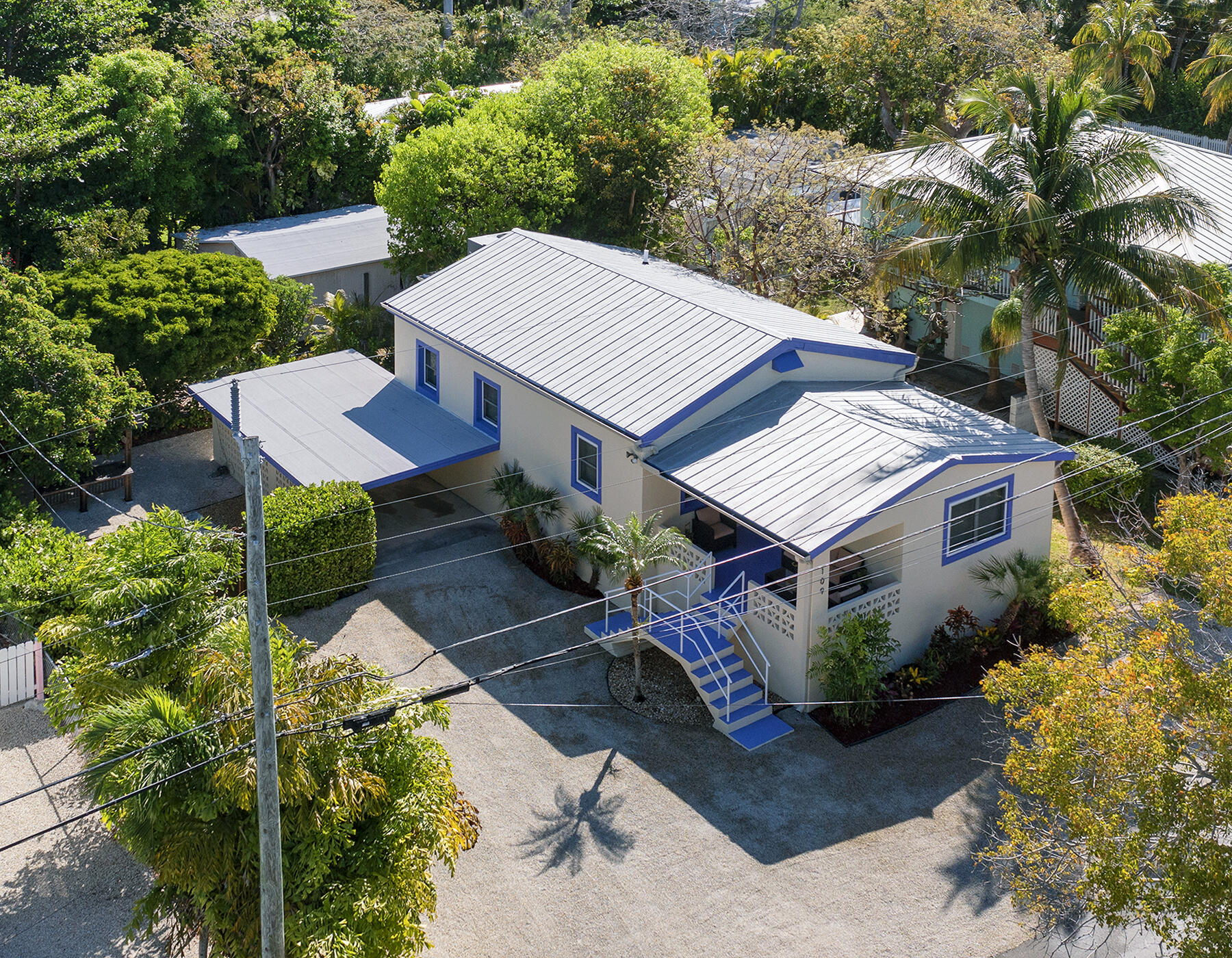 109 Beach Road Islamorada, FL 33036 - Photo 4 of 30 an aerial view of a house with a yard and potted plants